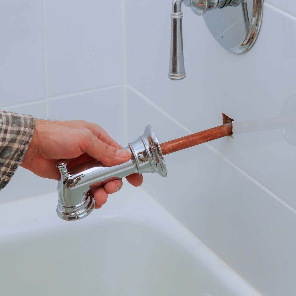 Installation or replacement of tub faucet.